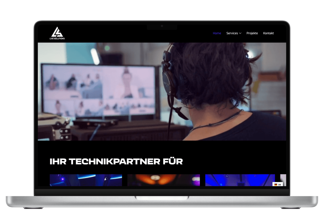 MacBook showing the home screen of the Live Solutions website
