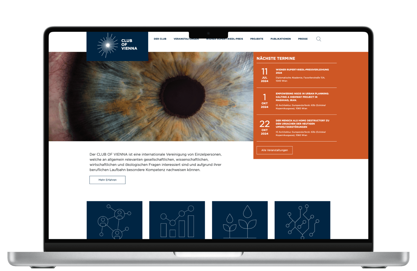 MacBook showing the home screen of the Club Of Vienna website